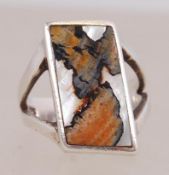 A contemporary 925 silver ring set with