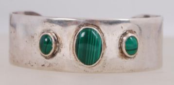 A silver collar bangle set with malachit
