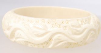 A vintage cucam Bakelite heavily carved