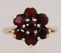 A 9ct gold garnet set ring. Hallmarked L