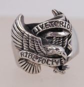 A contemporary white metal ring with Liv