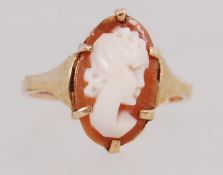 A 9ct gold ring set with an oval cameo.