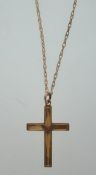 A 9ct gold crucifix - cross pendant and