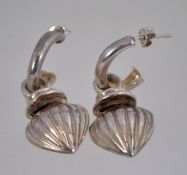 A pair of vintage 1980s silver hoop earrings with pendant drops,