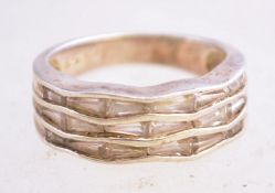 A silver and cubic zirconia ring, marked 