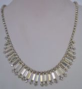 1950s rhinestone necklace in a silver tone metal setting with a hook clasp, measuring at 41cms long.