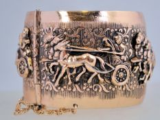 A large 1960's ' Ben Hur ' hinged bangle in rose gold tone metal with a pin clasp. Inner diameter 6.