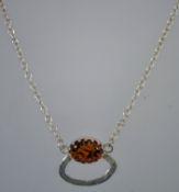 A silver and amber necklace, marked 