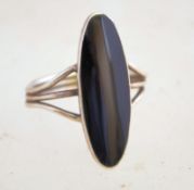 A vintage silver and black onyx ring, it is unmarked but it tests as silver.
