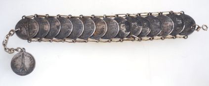 A vintage Paris souvenir bracelet with antiqued silvertone metal and a bolt ring clasp,