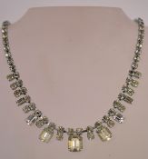 A 1950s rhinestone necklace in a silver tone metal setting with a bolt ring clasp, measuring at 40.
