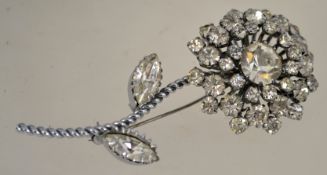 A large 1960s rhinestone brooch in a silver tone setting with a roll over clasp,