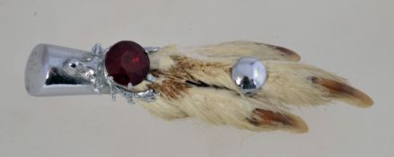 A vintage taxidermy grouse foot brooch by Mizpah,
