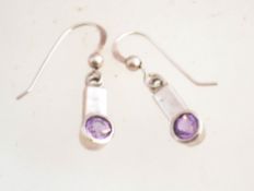 A pair of silver and amethyst drop earrings, marked 