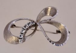 A modernist 1950s silver and crystal brooch measuring 5cms wide,