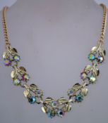 A 1970s rhinestone necklace in gold tone metal with a box clasp, measuring 41cms long.