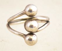 A vintage adjustable modernist silver ring, the hallmark has been poorly struck,