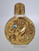 A vintage miniature perfume bottle, presumed 1960s, with pressed glass,