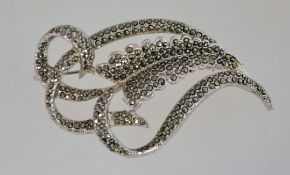 A large 1950s marcasite brooch in silver tone metal with a 