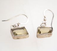 A pair of silver and topaz earrings, with a 