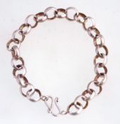 A silver over-size link bracelet fastened by a loop, marked 