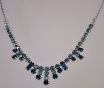 A 1950s rhinestone necklace in a silver tone metal setting with a bolt ring clasp,