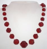 A 1920s to 1930s art deco red and pink glass bead necklace,