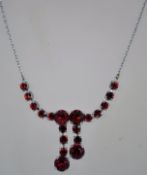 A 1950s rhinestone necklace in a silver tone metal setting with a bolt ring clasp, measuring at 41.