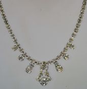 A 1950s rhinestone necklace in a silver tone metal setting with a bolt ring clasp, measuring 39.