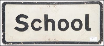 A vintage 1970's road sign ' School ' on metal with painted frontage having central notation.