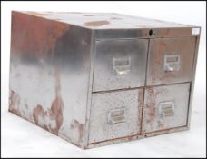 A polished steel mid century Industrial factory 4 drawer desk top filing index cabinet.