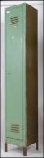 A vintage mid century Industrial slim metal locker with full length door having vented top raised