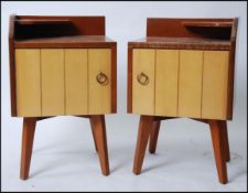 A pair of 1950's retro oak and maple wood bedside cabinets raised on square tapered legs with