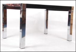An Italian Mid Century Vintage chrome & glass draw leaf dining table.