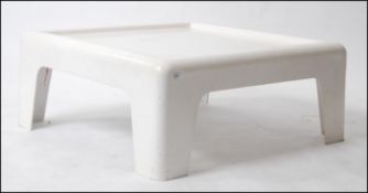 A 1970's white plastic - resin cast coffee table in the manner of Vico Magistretti.