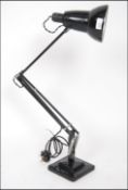 A mid century Industrial Herbert Terry 1227 model anglepoise desk lamp raised on a twin step square