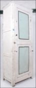 A vintage mid century Shabby Chic painted two tone kitchen pedestal cupboard.