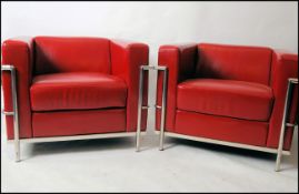 After Le Corbusier. A pair of ' LC2 ' type red leather and chrome armchairs.