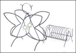 A mid century retro vintage magazine / record rack in the form of a butterfly / bug / insect .