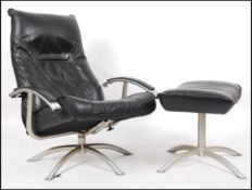 A 1970's retro Kebe of Denmark - Danish 20th century black leather reclining armchair on four
