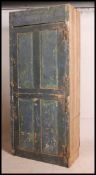 A 19th century large shabby chic painted elm wood housekeepers cupboard.