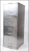 A polished steel mid century Industrial factory pedestal office 4 drawer filing cabinet.