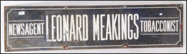 A Vintage early 20th century enamel industrial advertising sign for Leonard Meakings Newsagent &