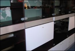 A 1970's Modular Hulsta retro modular upright 4 section cabinet system withs smoked glass,