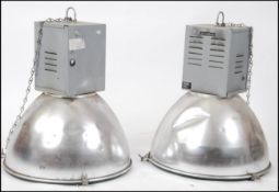 A pair of 20th century large Industrial pendant factory lights with aluminium oversized shades on