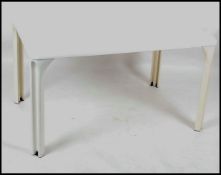 A 1970's retro Italian dining table in white by Vico Magistretti.