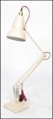 A mid century Industrial Herbert Terry 1227 model anglepoise desk lamp raised on a twin step square