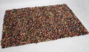 A 1970's British retro l- vintage large - deep pile plush rectangular floor rug being multicoloured.
