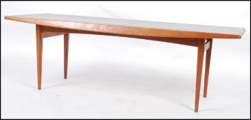 A 1960's teak wood Gordon Russell rectangular coffee / occasional table raised on tapered supports