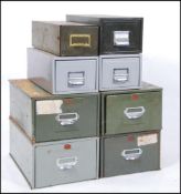 A collection of vintage mid century Industrial office factory filing cabinets.